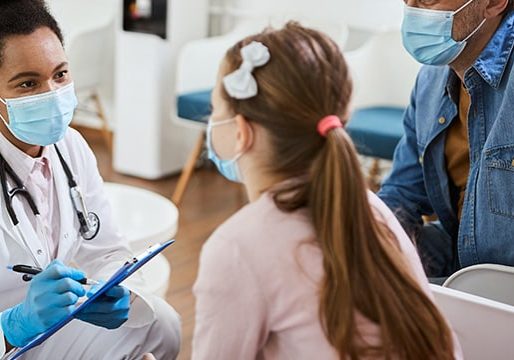 worried black dentist with face mask communicating